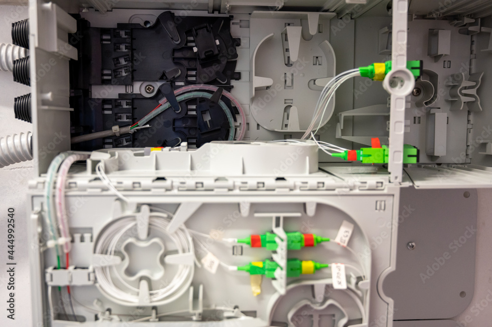 Close up shot of cabling of the optical fibers inside the distribution box. Close up shot of cabling of the optical fibers inside the distribution box.