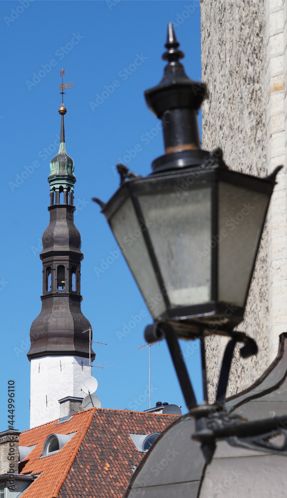 old street lantern in front of a church dome, and a tiled roof, Tallinn, Estonia old street lantern in front of a church dome, and a tiled roof, Tallinn, Estonia
