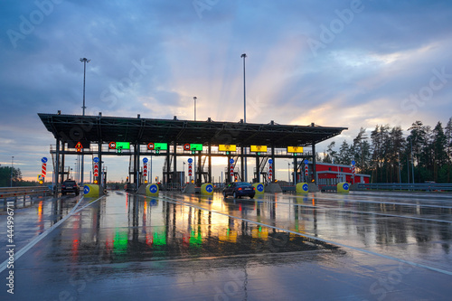 Russian highway number M11 from Moscow to St. Petersburg, an automatic toll station. Drive through the barrier using a transponder. photo