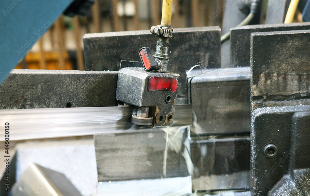 Steel flat rebar on sanding roller machine with water cooled system in polish steel surface process. Steel flat rebar on sanding roller machine with water cooled system in polish steel surface process.