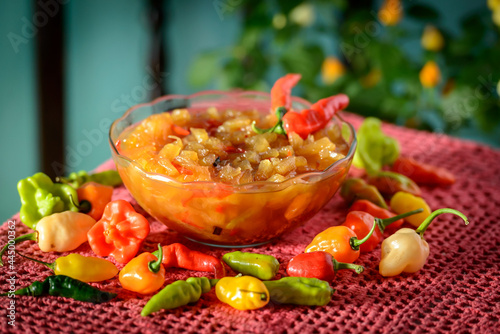 Pineapple jam with pepper in glass bowl. Traditional dessert from northeastern Brazil. photo