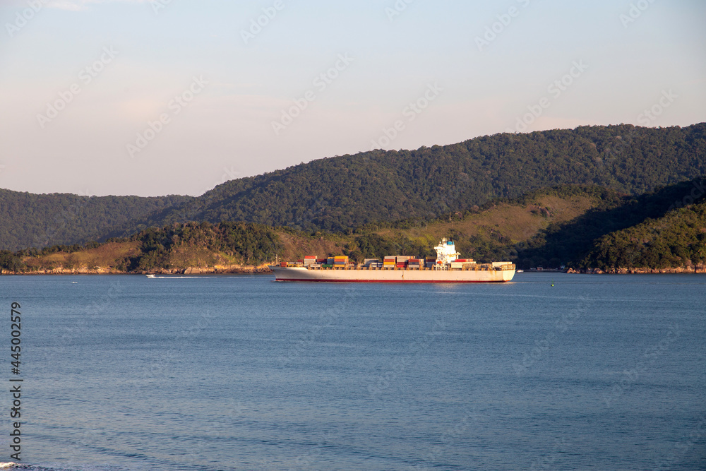 Santos beach panoramic view from above. Ship entering the Port of Santos Santos beach panoramic view from above. Ship entering the Port of Santos