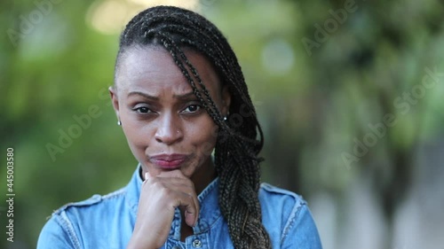 Judgemental African woman emotion. Portrait skeptical black person photo