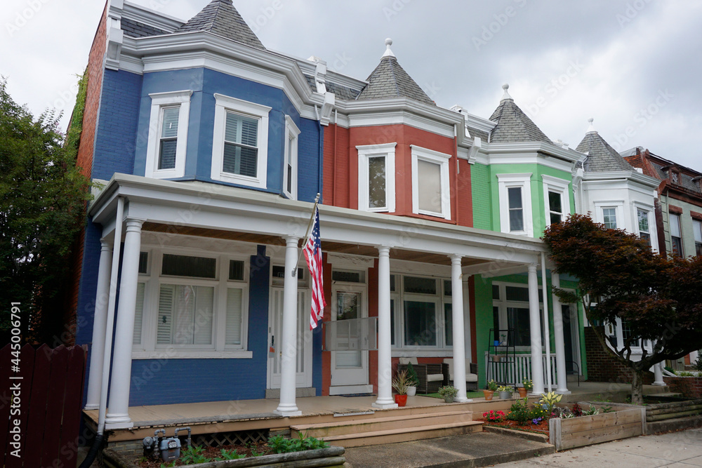 Colorful Row Houses with flowers and an american flag