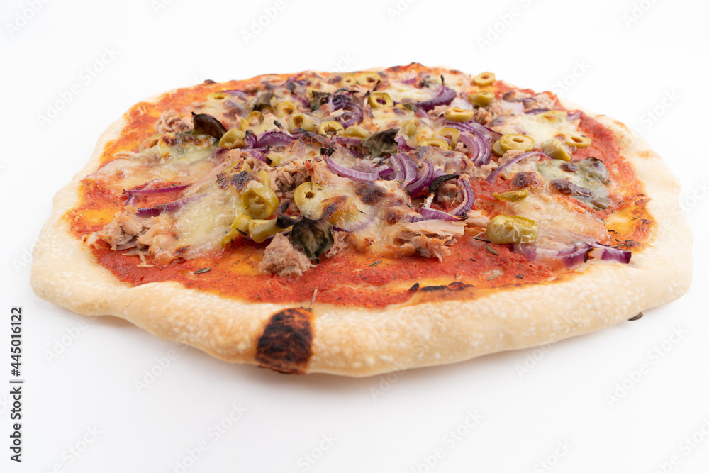 Wide angle studio shot of freshly baked pizza al tonno isolated on white background. Tuna, olives, onions, veggies, crust, tomato sauce. Wide angle studio shot of freshly baked pizza al tonno isolated on white background. Tuna, olives, onions, veggies, crust, tomato sauce.