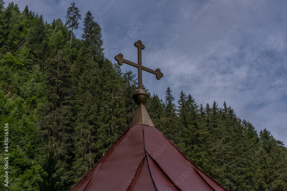 Wolfaukapelle chapel in sunny cloudy morning in Austria mountains Wolfaukapelle chapel in sunny cloudy morning in Austria mountains