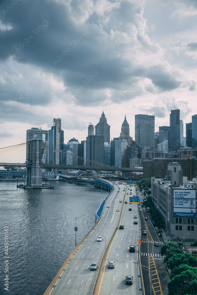 View of FDR Drive and the Financial District with a stormy sky, from the Manhattan Bridge in New York City View of FDR Drive and the Financial District with a stormy sky, from the Manhattan Bridge in New York City