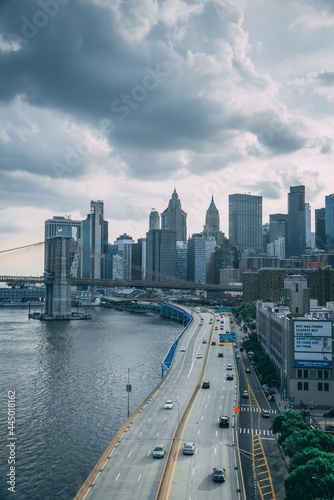 View of FDR Drive and the Financial District with a stormy sky, from the Manhattan Bridge in New York City