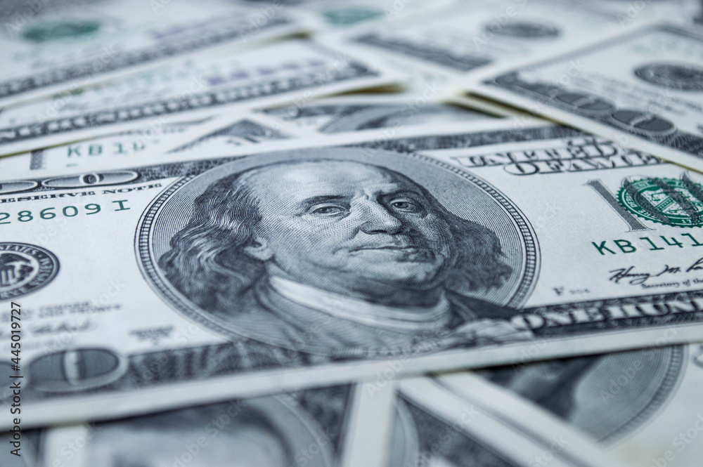 One hundred US dollars banknotes. Cash one hundred dollar bills, 100 dollars, Benjamin Franklin portrait, american currency exchange finance. One hundred US dollars banknotes. Cash one hundred dollar bills, 100 dollars, Benjamin Franklin portrait, american currency exchange finance.