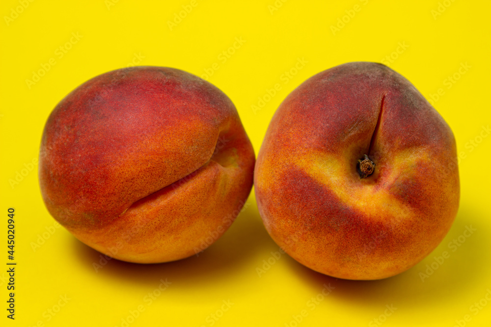 Peaches on a yellow background. Peach cut in half. Healthy diet. Peaches on a yellow background. Peach cut in half. Healthy diet.