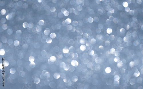 gray horizontal background with white glowing bokeh