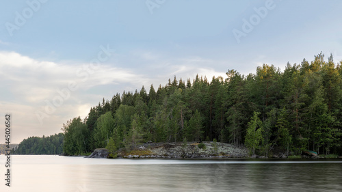 Long exposure photo of quiet Island on Finnish lake P  ij  nne