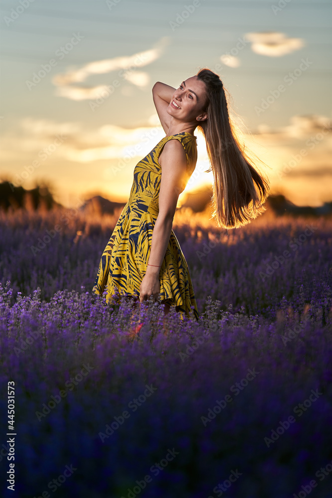 Obraz premium Young woman in blooming lavender field