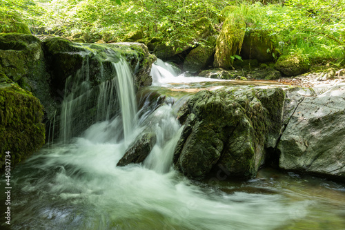 Long exposure of a waterfall on the Hoar Oak Water river at Watersmeet in Exmoor National Park