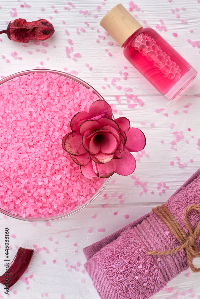 Top view pink himalayan salt with towel and body lotion. Top view pink himalayan salt with towel and body lotion.