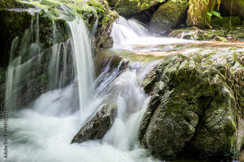 Long exposure of a waterfall on the Hoar Oak Water river at Watersmmeet in Exmoor National Park