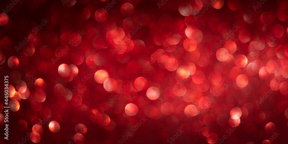red horizontal background with glowing bokeh. christmas banner red horizontal background with glowing bokeh. christmas banner