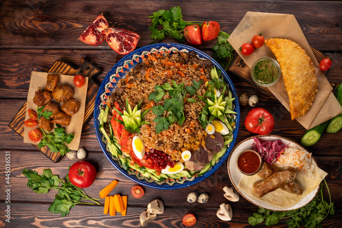 Photography Ready Uzbek pilaf in a large plate, garnished with vegetables