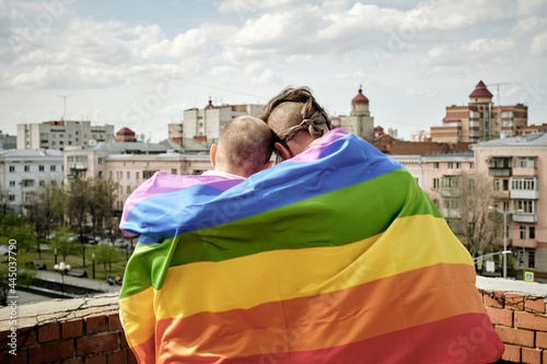 Gay Men Wrapped in Rainbow Flag