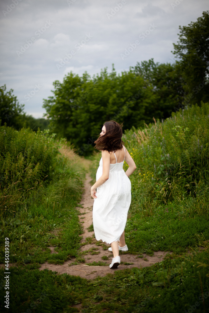 running bride in white dress in a field running bride in white dress in a field