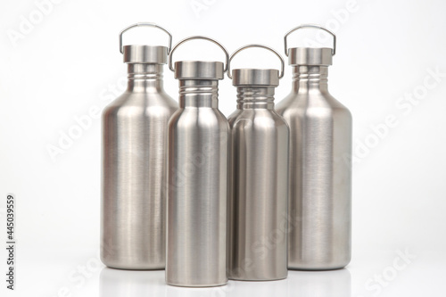 Steel flasks for water and drinks on a white background. Survival hiking gear
