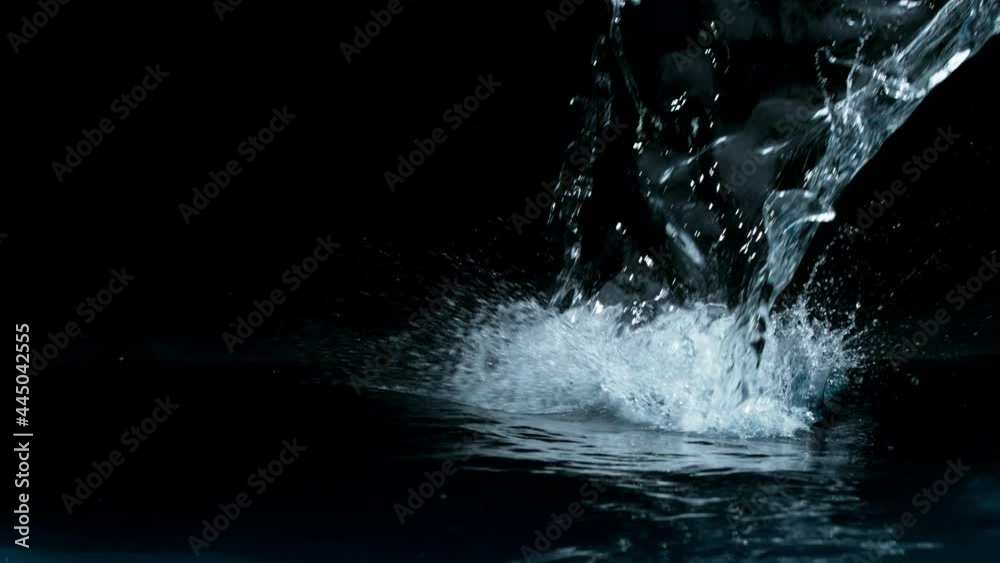 Super slow motion of water splash on black background. Filmed on high speed cinema camera, 1000 fps. Super slow motion of water splash on black background. Filmed on high speed cinema camera, 1000 fps.