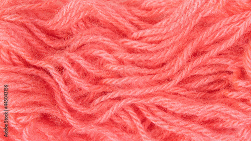 Close up of fuzzy pink yarn textured background