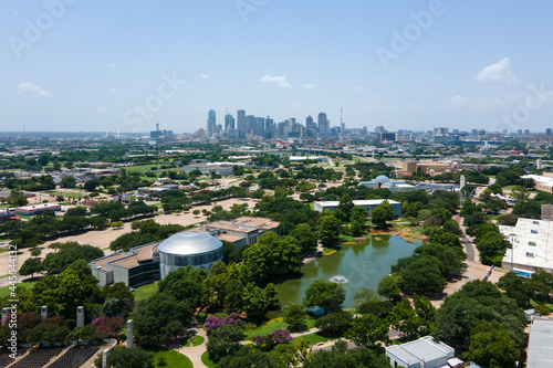 Dallas, Texas  USA 07-13-2021 Aerial View of Dallas Texas skyline looking east to west from Texas State Fairgrounds at Daytime with Blue Sky 