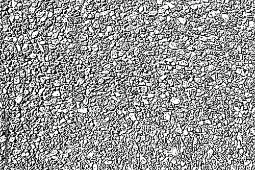 Grunge texture of a wall made of small stones. Monochrome background of fine gravel with spots, noise and grain. Overlay template. Vector illustration