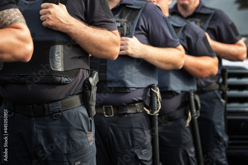 Soldiers security in the ranks, ammunition equipment and weapons, with a shallow depth of field