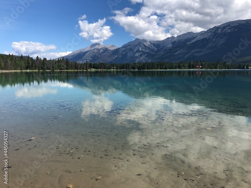 Perfect reflection of mountains in clear water Edith Lake in Jasper Alberta, Canada