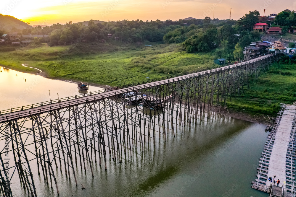 Mon Bridge, old wooden bridge at sunset in Sangkhlaburi, Kanchanaburi, Thailand Mon Bridge, old wooden bridge at sunset in Sangkhlaburi, Kanchanaburi, Thailand