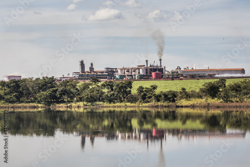 Sugarcane processing plant in operation  with dam in the foreground in the interior of Goias  Brazil