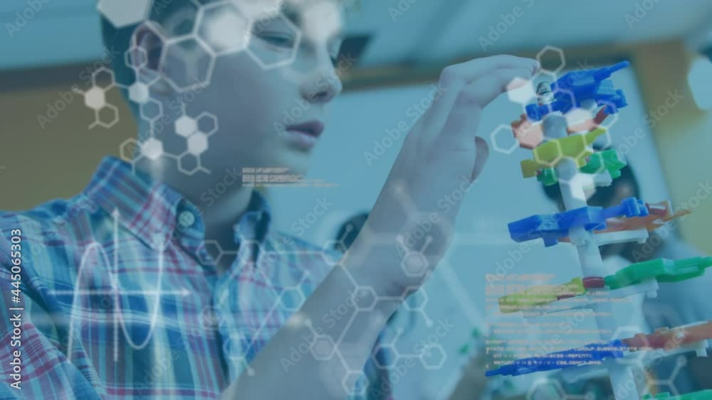 Chemical structures and data processing against boy touching dna structure model at laboratory Chemical structures and data processing against boy touching dna structure model at laboratory