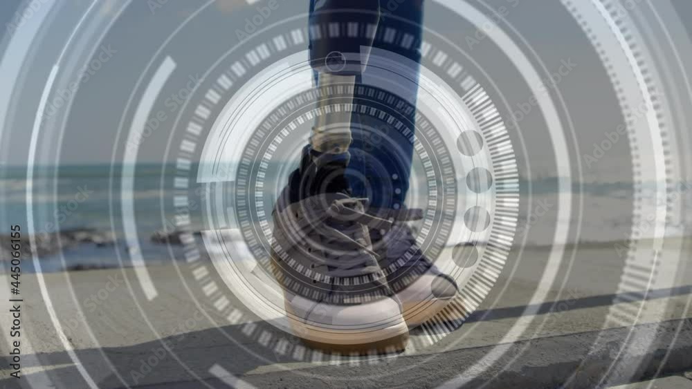 Animation of scope scanning over woman with artificial limb standing by seaside