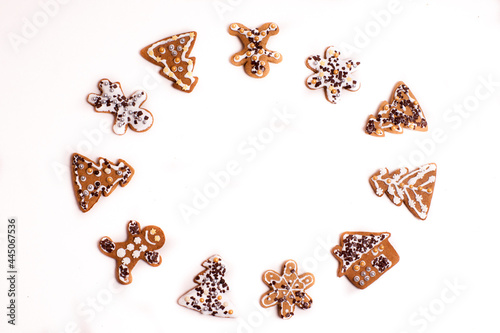 Gingerbread cookies lying on a white background arranged in the shape of a circle.