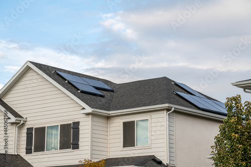 Upper part exterior of a two storey house with solar panels