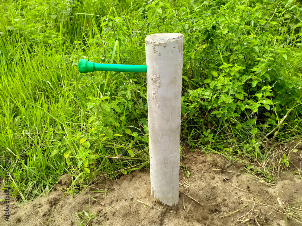 water supply piped and white post green nature water supply piped and white post green nature