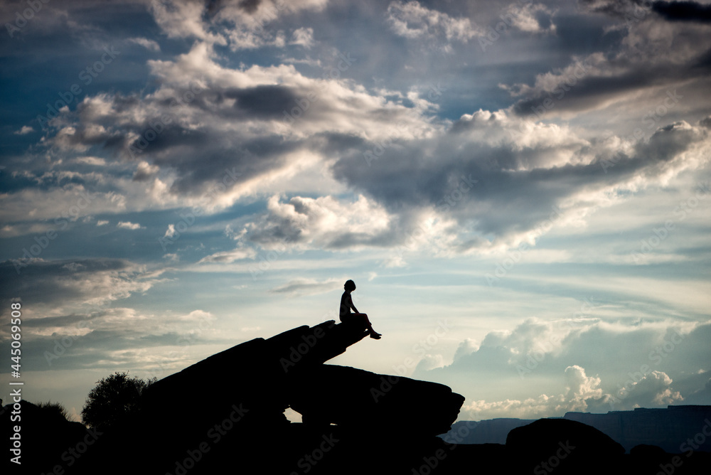 silhouette of a girl on the top of mountain silhouette of a girl on the top of mountain