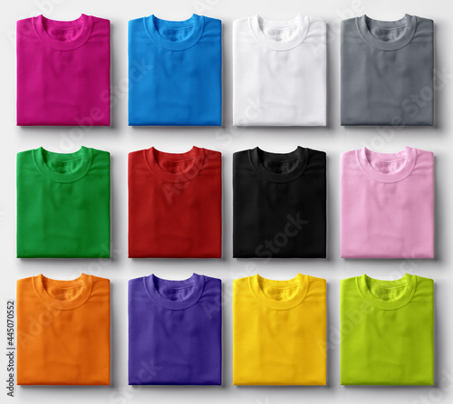 Folded colorful t-shirts on white background.