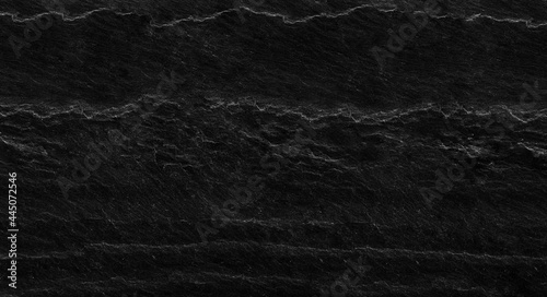 Black lined marble stone texture background, Mountain close-up. Distressed backdrop.