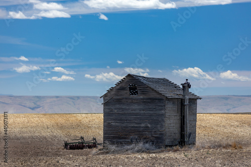 Abandoned old farm building in a field