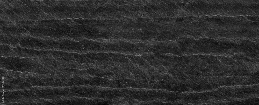 Fototapeta premium Panorama black lined marble stone background with copy space. Black grunge banner with rock texture.