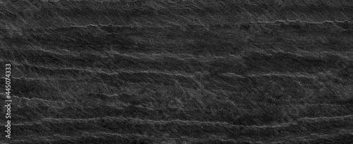 Panorama black lined marble stone background with copy space. Black grunge banner with rock texture.