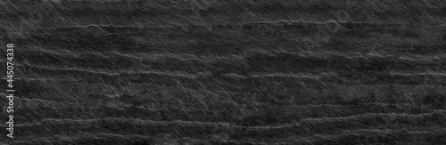 Panorama black lined marble stone background with copy space. Black grunge banner with rock texture.