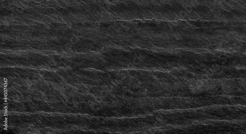 Black lined marble stone background with copy space. Black grunge banner with rock texture.