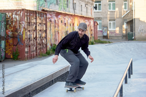 skateboarder prepares to jump on the parapet