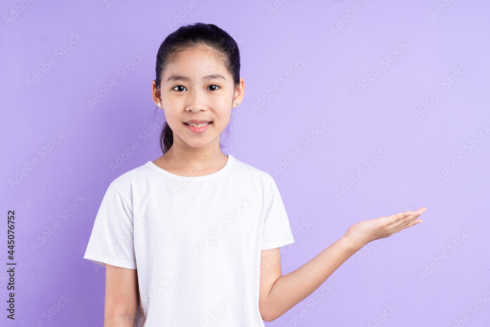 Portrait of Asian child on purple background Portrait of Asian child on purple background