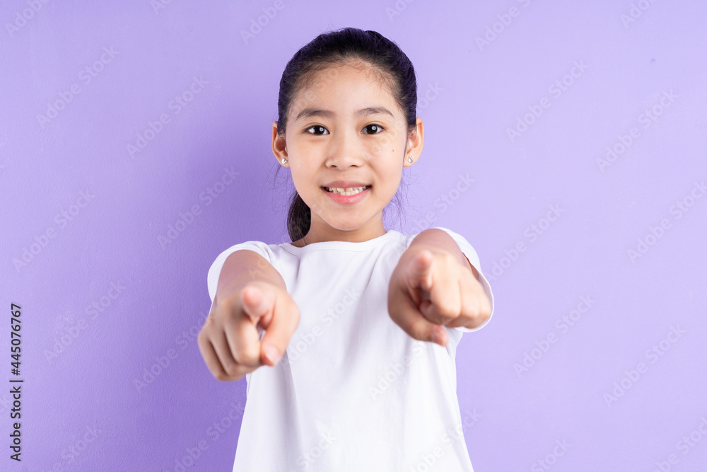 Portrait of Asian child on purple background Portrait of Asian child on purple background