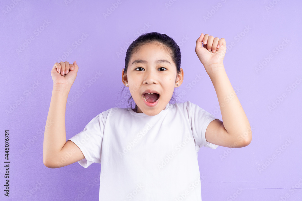 Portrait of Asian child on purple background Portrait of Asian child on purple background